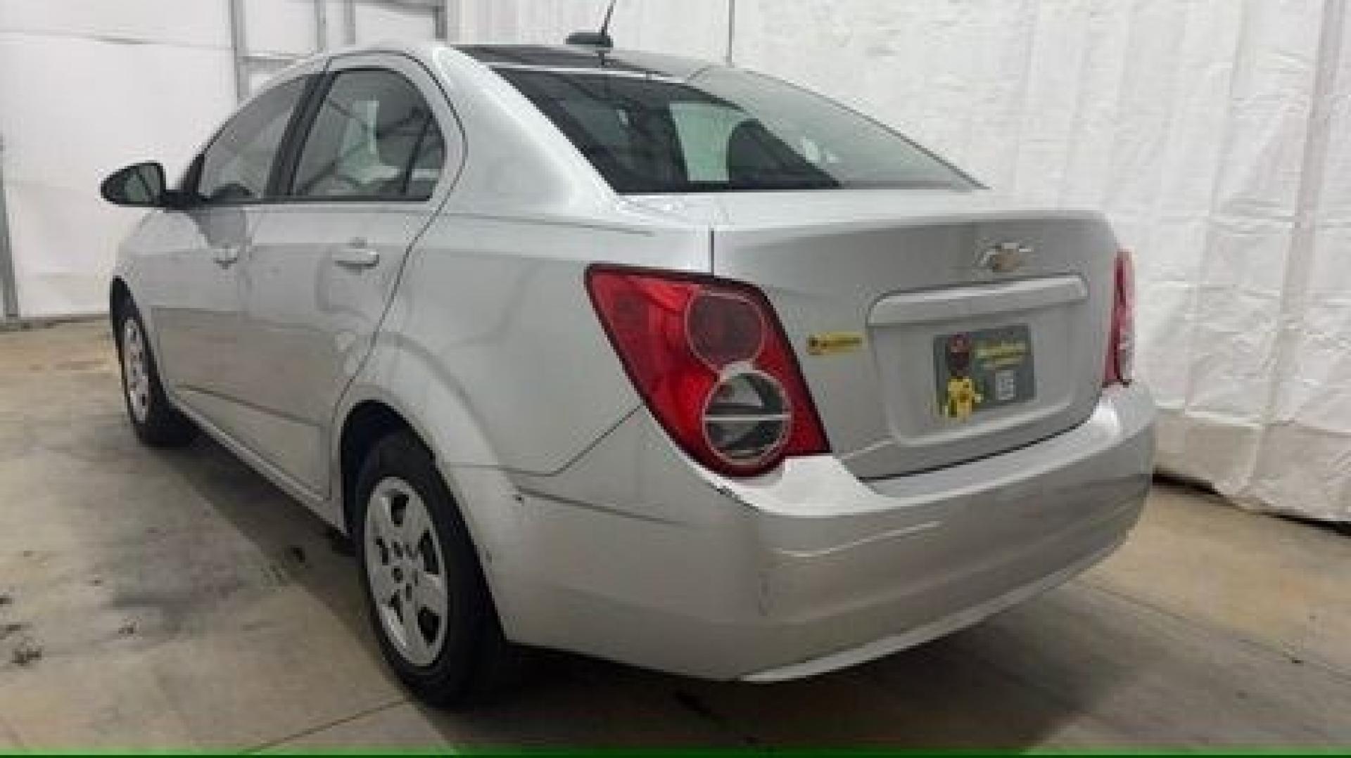 2015 Silver Chevrolet Sonic LS Auto Sedan (1G1JA5SH0F4) with an 1.8L L4 DOHC 24V engine, 6-Speed Automatic transmission, located at 1806 Veterans Memorial Hwy SW, Austell, GA, 30168, (770) 944-9558, 33.817959, -84.606987 - Photo#3