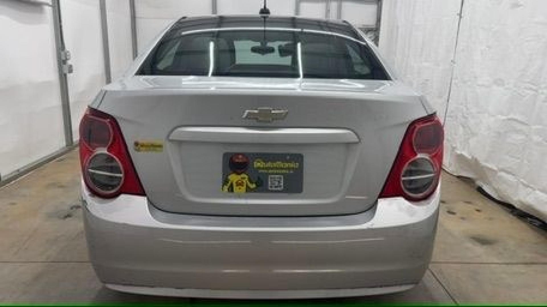 2015 Silver Chevrolet Sonic LS Auto Sedan (1G1JA5SH0F4) with an 1.8L L4 DOHC 24V engine, 6-Speed Automatic transmission, located at 1806 Veterans Memorial Hwy SW, Austell, GA, 30168, (770) 944-9558, 33.817959, -84.606987 - Photo#4