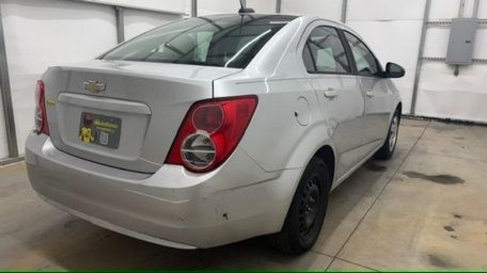 2015 Silver Chevrolet Sonic LS Auto Sedan (1G1JA5SH0F4) with an 1.8L L4 DOHC 24V engine, 6-Speed Automatic transmission, located at 1806 Veterans Memorial Hwy SW, Austell, GA, 30168, (770) 944-9558, 33.817959, -84.606987 - Photo#5
