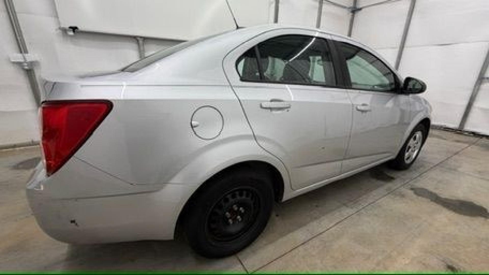 2015 Silver Chevrolet Sonic LS Auto Sedan (1G1JA5SH0F4) with an 1.8L L4 DOHC 24V engine, 6-Speed Automatic transmission, located at 1806 Veterans Memorial Hwy SW, Austell, GA, 30168, (770) 944-9558, 33.817959, -84.606987 - Photo#6