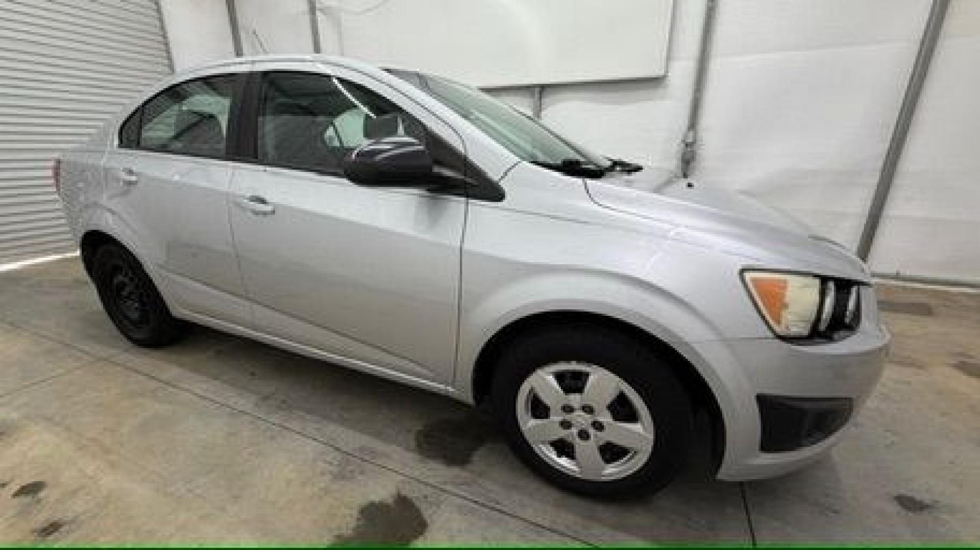 2015 Silver Chevrolet Sonic LS Auto Sedan (1G1JA5SH0F4) with an 1.8L L4 DOHC 24V engine, 6-Speed Automatic transmission, located at 1806 Veterans Memorial Hwy SW, Austell, GA, 30168, (770) 944-9558, 33.817959, -84.606987 - Photo#7