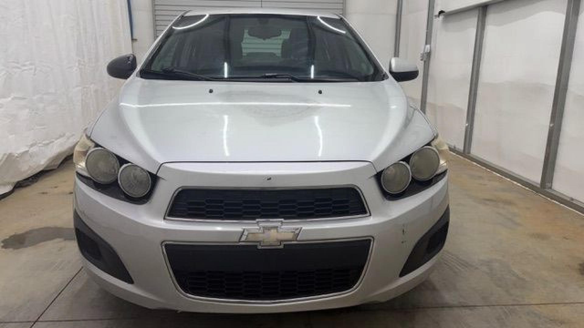 2015 Silver Chevrolet Sonic LS Auto Sedan (1G1JA5SH0F4) with an 1.8L L4 DOHC 24V engine, 6-Speed Automatic transmission, located at 1806 Veterans Memorial Hwy SW, Austell, GA, 30168, (770) 944-9558, 33.817959, -84.606987 - Photo#9