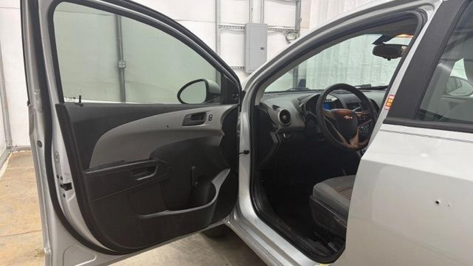 2015 Silver Chevrolet Sonic LS Auto Sedan (1G1JA5SH0F4) with an 1.8L L4 DOHC 24V engine, 6-Speed Automatic transmission, located at 1806 Veterans Memorial Hwy SW, Austell, GA, 30168, (770) 944-9558, 33.817959, -84.606987 - Photo#10