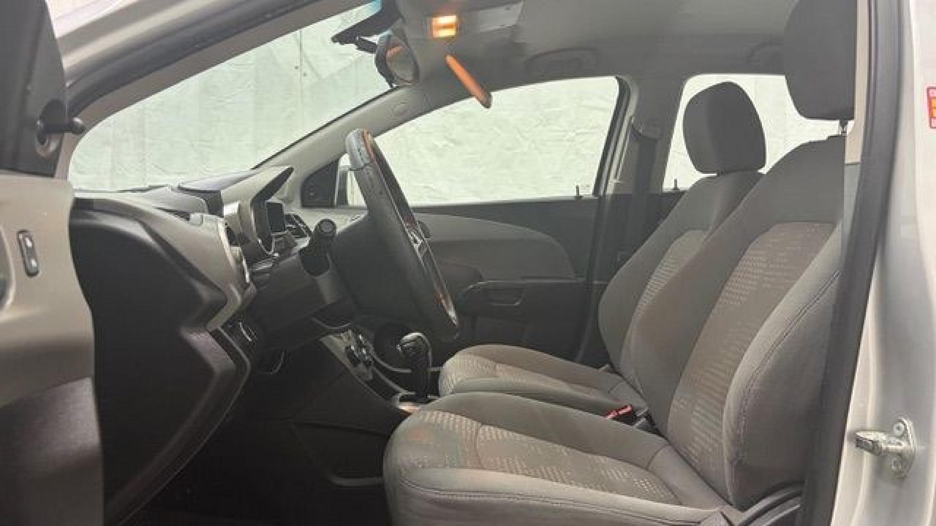 2015 Silver Chevrolet Sonic LS Auto Sedan (1G1JA5SH0F4) with an 1.8L L4 DOHC 24V engine, 6-Speed Automatic transmission, located at 1806 Veterans Memorial Hwy SW, Austell, GA, 30168, (770) 944-9558, 33.817959, -84.606987 - Photo#11