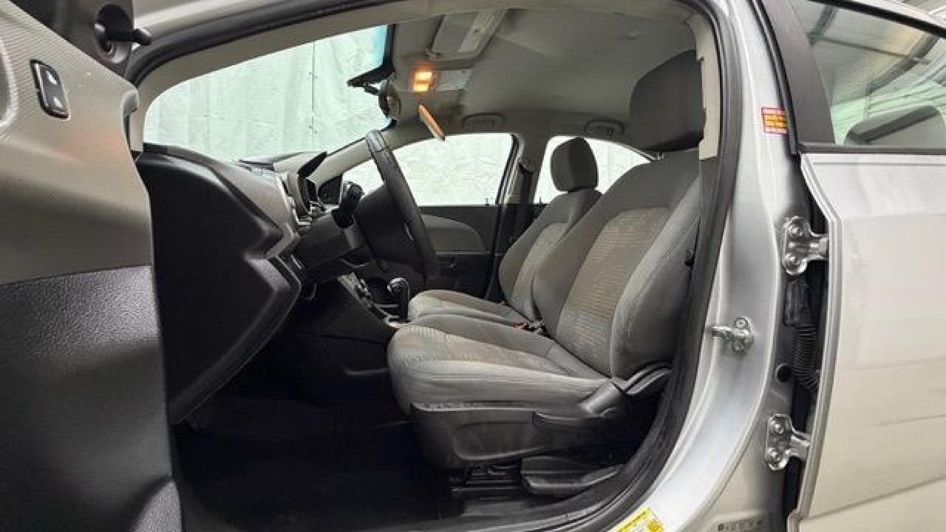 2015 Silver Chevrolet Sonic LS Auto Sedan (1G1JA5SH0F4) with an 1.8L L4 DOHC 24V engine, 6-Speed Automatic transmission, located at 1806 Veterans Memorial Hwy SW, Austell, GA, 30168, (770) 944-9558, 33.817959, -84.606987 - Photo#12