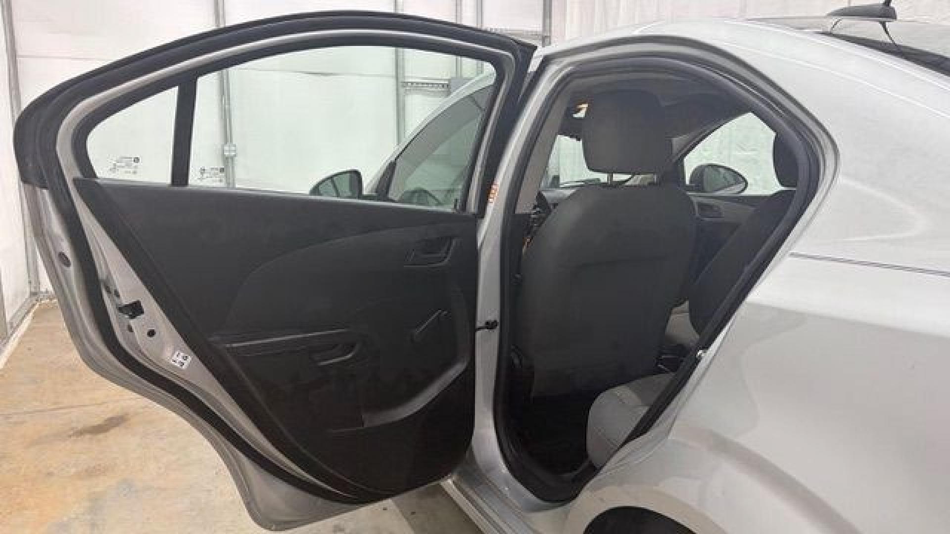 2015 Silver Chevrolet Sonic LS Auto Sedan (1G1JA5SH0F4) with an 1.8L L4 DOHC 24V engine, 6-Speed Automatic transmission, located at 1806 Veterans Memorial Hwy SW, Austell, GA, 30168, (770) 944-9558, 33.817959, -84.606987 - Photo#13