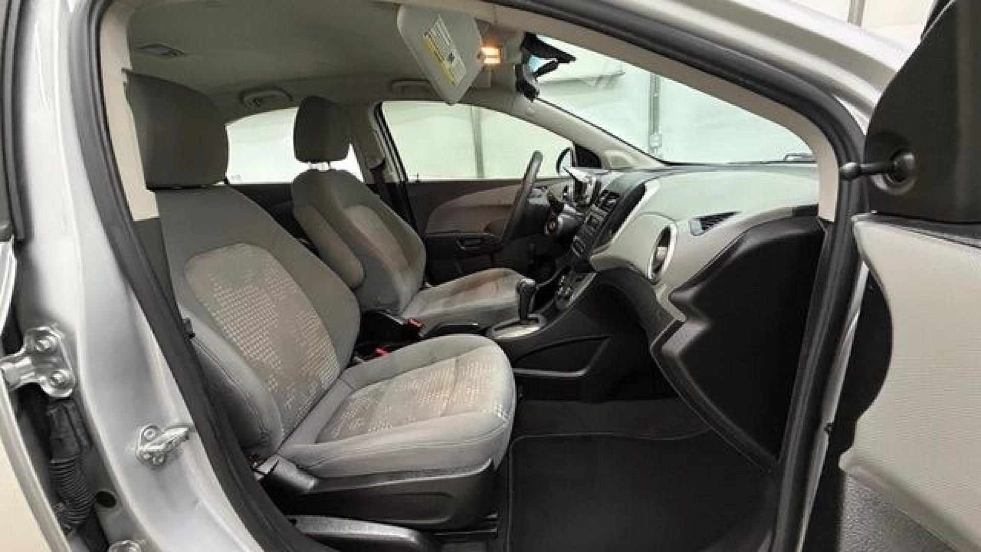 2015 Silver Chevrolet Sonic LS Auto Sedan (1G1JA5SH0F4) with an 1.8L L4 DOHC 24V engine, 6-Speed Automatic transmission, located at 1806 Veterans Memorial Hwy SW, Austell, GA, 30168, (770) 944-9558, 33.817959, -84.606987 - Photo#18