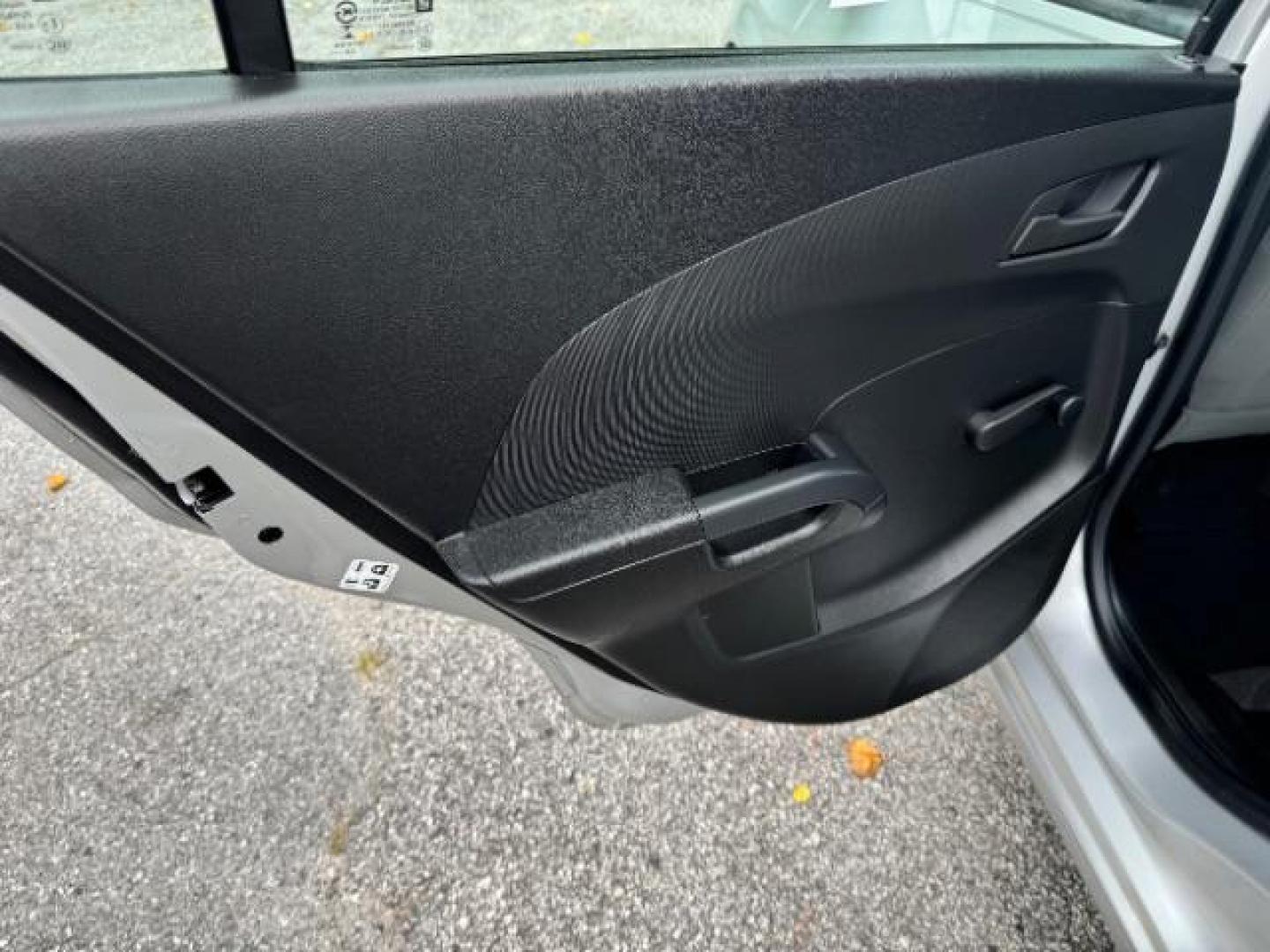 2015 Silver Chevrolet Sonic LS Auto Sedan (1G1JA5SH0F4) with an 1.8L L4 DOHC 24V engine, 6-Speed Automatic transmission, located at 1806 Veterans Memorial Hwy SW, Austell, GA, 30168, (770) 944-9558, 33.817959, -84.606987 - Photo#9