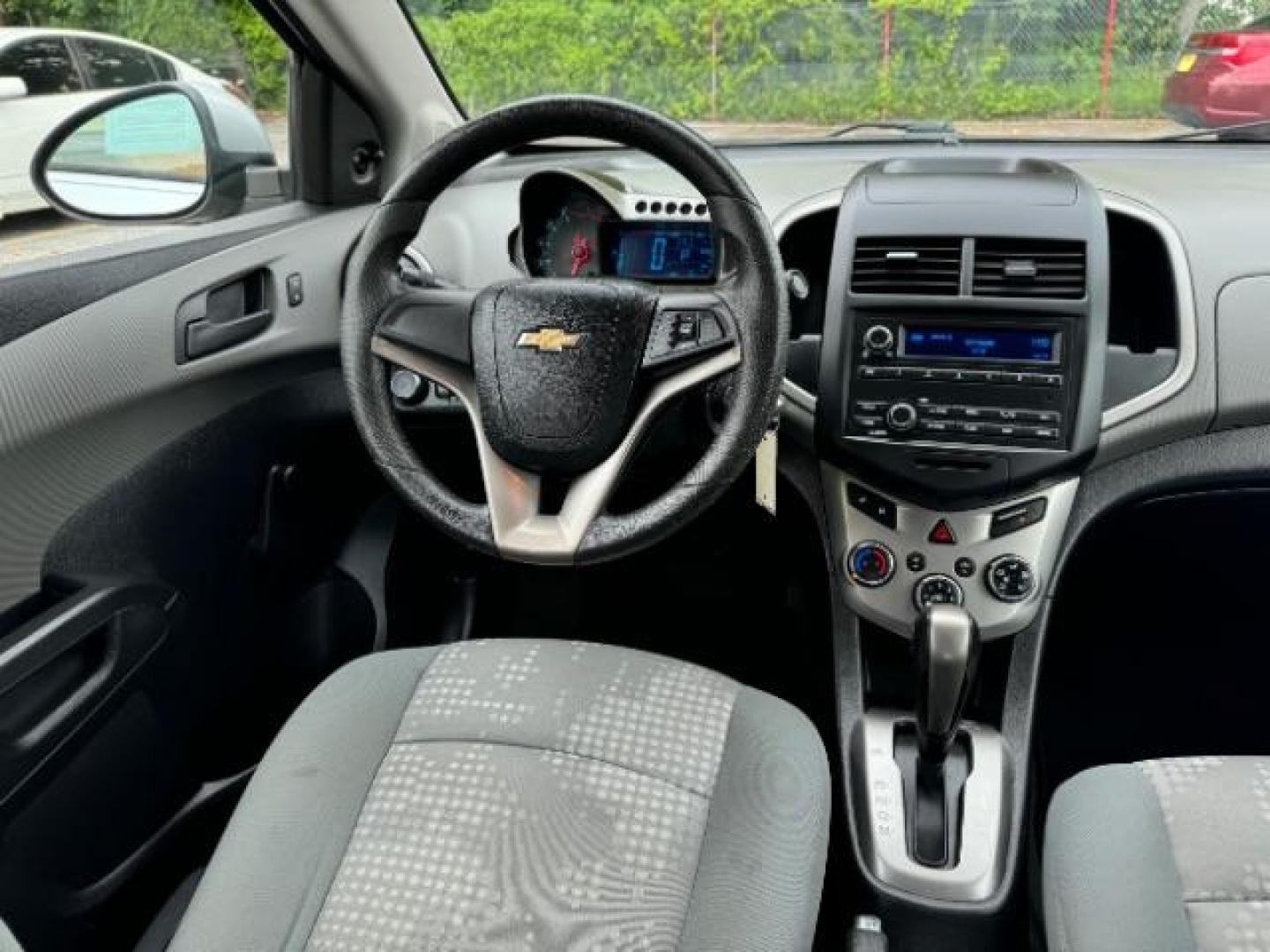 2015 Silver Chevrolet Sonic LS Auto Sedan (1G1JA5SH0F4) with an 1.8L L4 DOHC 24V engine, 6-Speed Automatic transmission, located at 1806 Veterans Memorial Hwy SW, Austell, GA, 30168, (770) 944-9558, 33.817959, -84.606987 - Photo#11