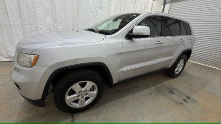 2012 Silver Jeep Grand Cherokee Laredo 2WD (1C4RJEAG6CC) with an 3.6L V6 DOHC 24V engine, 5-Speed Automatic transmission, located at 1806 Veterans Memorial Hwy SW, Austell, GA, 30168, (770) 944-9558, 33.817959, -84.606987 - Photo#1