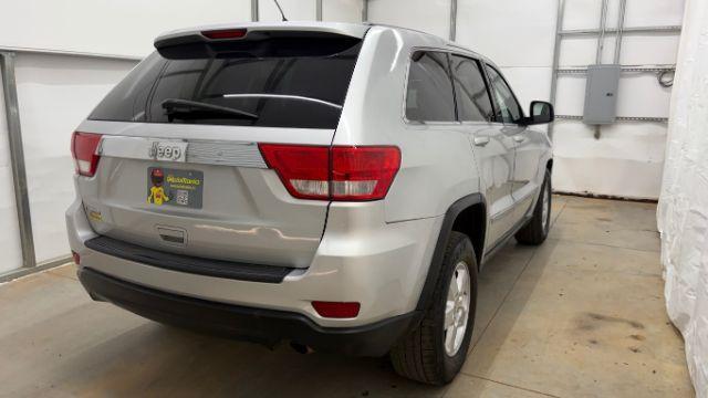 2012 Silver Jeep Grand Cherokee Laredo 2WD (1C4RJEAG6CC) with an 3.6L V6 DOHC 24V engine, 5-Speed Automatic transmission, located at 1806 Veterans Memorial Hwy SW, Austell, GA, 30168, (770) 944-9558, 33.817959, -84.606987 - Photo#5
