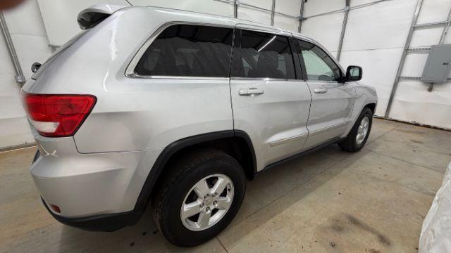 2012 Silver Jeep Grand Cherokee Laredo 2WD (1C4RJEAG6CC) with an 3.6L V6 DOHC 24V engine, 5-Speed Automatic transmission, located at 1806 Veterans Memorial Hwy SW, Austell, GA, 30168, (770) 944-9558, 33.817959, -84.606987 - Photo#6
