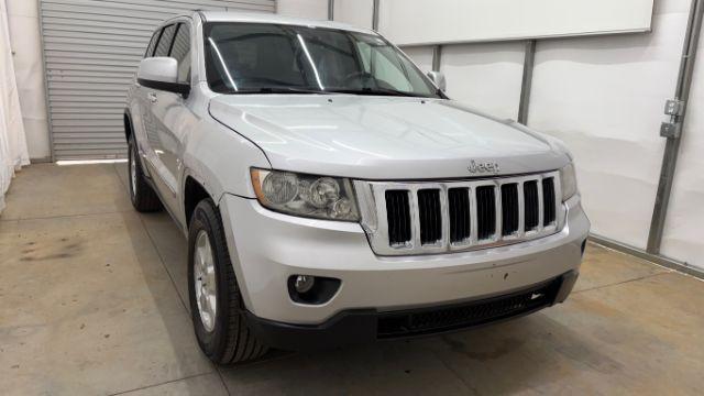 2012 Silver Jeep Grand Cherokee Laredo 2WD (1C4RJEAG6CC) with an 3.6L V6 DOHC 24V engine, 5-Speed Automatic transmission, located at 1806 Veterans Memorial Hwy SW, Austell, GA, 30168, (770) 944-9558, 33.817959, -84.606987 - Photo#7