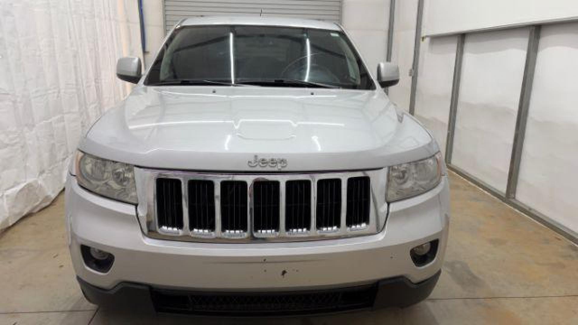 2012 Silver Jeep Grand Cherokee Laredo 2WD (1C4RJEAG6CC) with an 3.6L V6 DOHC 24V engine, 5-Speed Automatic transmission, located at 1806 Veterans Memorial Hwy SW, Austell, GA, 30168, (770) 944-9558, 33.817959, -84.606987 - Photo#8