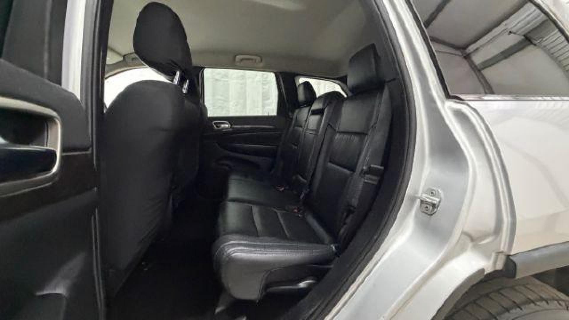 2012 Silver Jeep Grand Cherokee Laredo 2WD (1C4RJEAG6CC) with an 3.6L V6 DOHC 24V engine, 5-Speed Automatic transmission, located at 1806 Veterans Memorial Hwy SW, Austell, GA, 30168, (770) 944-9558, 33.817959, -84.606987 - Photo#13