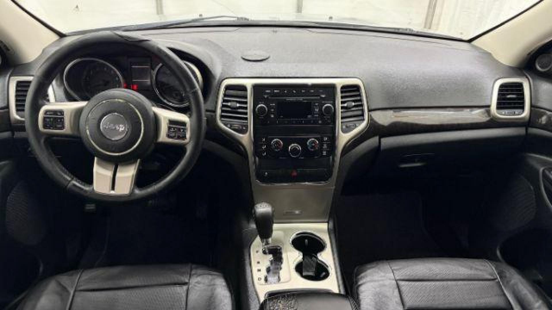 2012 Silver Jeep Grand Cherokee Laredo 2WD (1C4RJEAG6CC) with an 3.6L V6 DOHC 24V engine, 5-Speed Automatic transmission, located at 1806 Veterans Memorial Hwy SW, Austell, GA, 30168, (770) 944-9558, 33.817959, -84.606987 - Photo#14