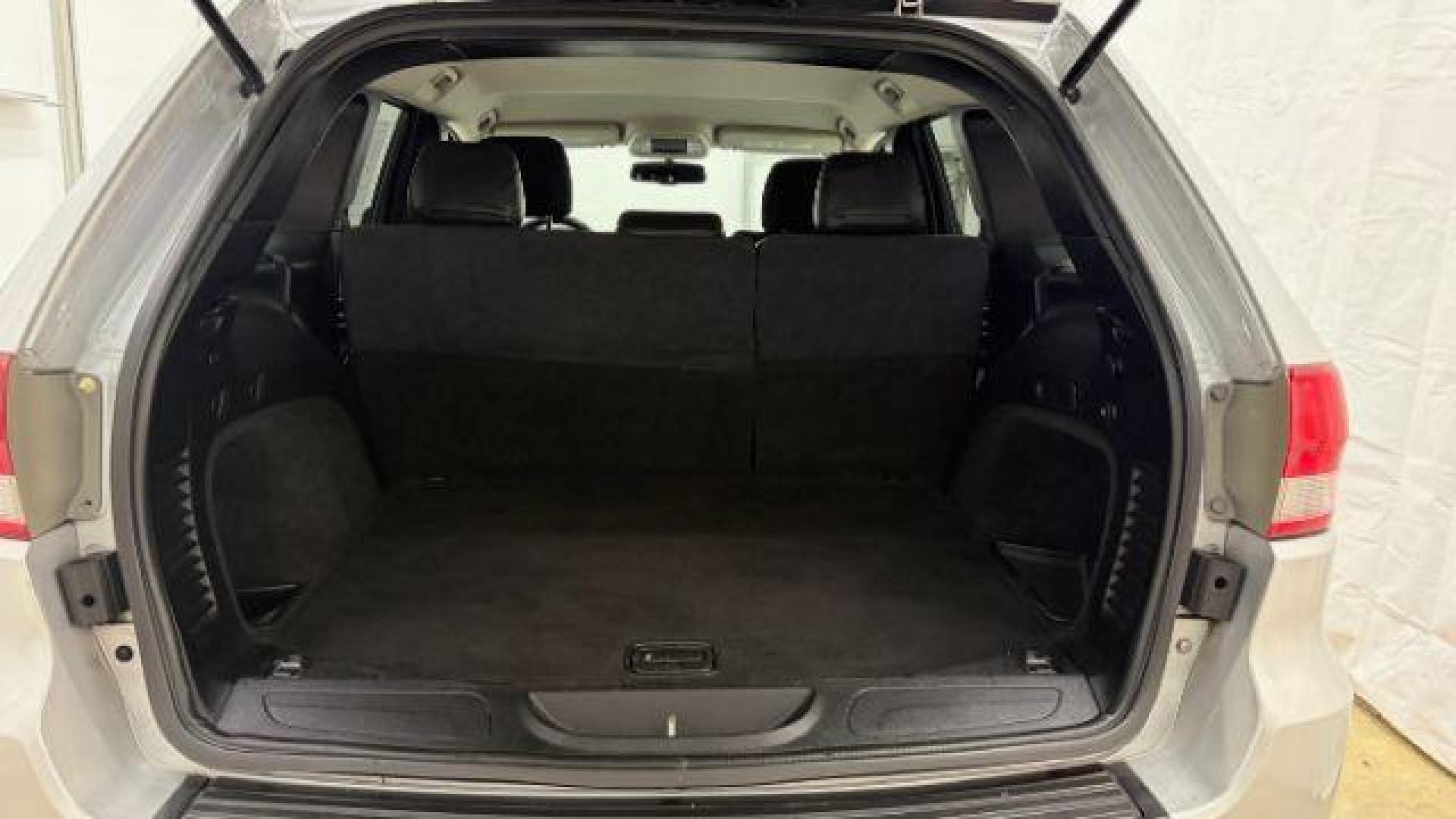 2012 Silver Jeep Grand Cherokee Laredo 2WD (1C4RJEAG6CC) with an 3.6L V6 DOHC 24V engine, 5-Speed Automatic transmission, located at 1806 Veterans Memorial Hwy SW, Austell, GA, 30168, (770) 944-9558, 33.817959, -84.606987 - Photo#15