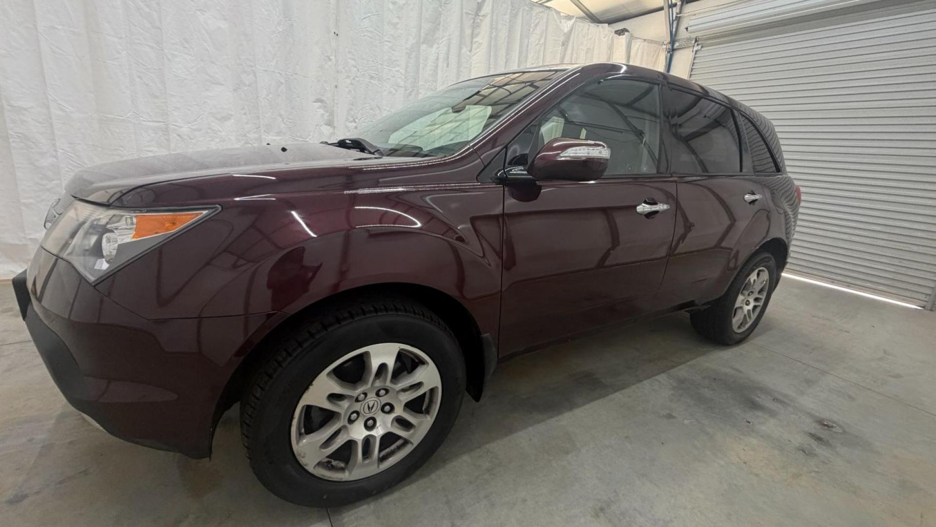 2009 Maroon Acura MDX Base (2HNYD282X9H) with an 3.7L V6 SOHC 24V engine, 5-Speed Automatic transmission, located at 1806 Veterans Memorial Hwy SW, Austell, GA, 30168, (770) 944-9558, 33.817959, -84.606987- Photo#1