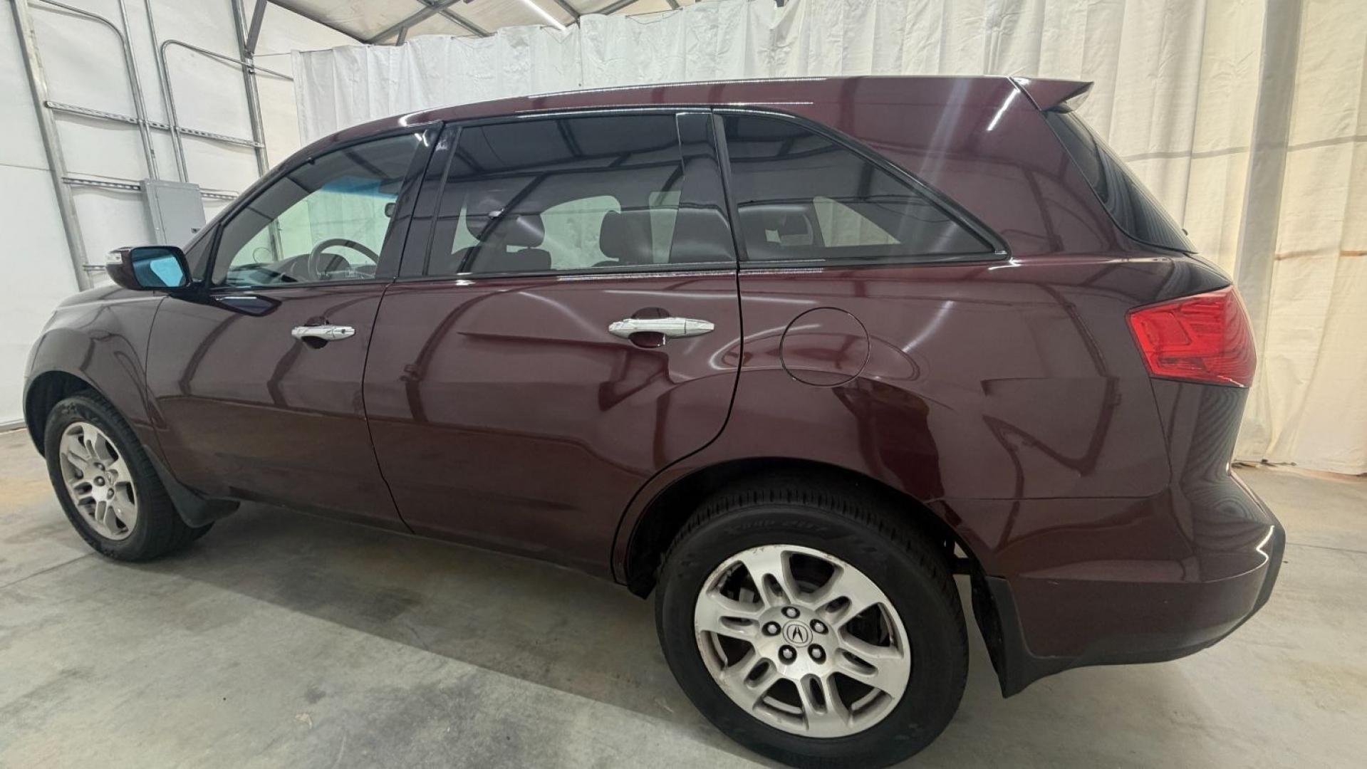 2009 Maroon Acura MDX Base (2HNYD282X9H) with an 3.7L V6 SOHC 24V engine, 5-Speed Automatic transmission, located at 1806 Veterans Memorial Hwy SW, Austell, GA, 30168, (770) 944-9558, 33.817959, -84.606987- Photo#2