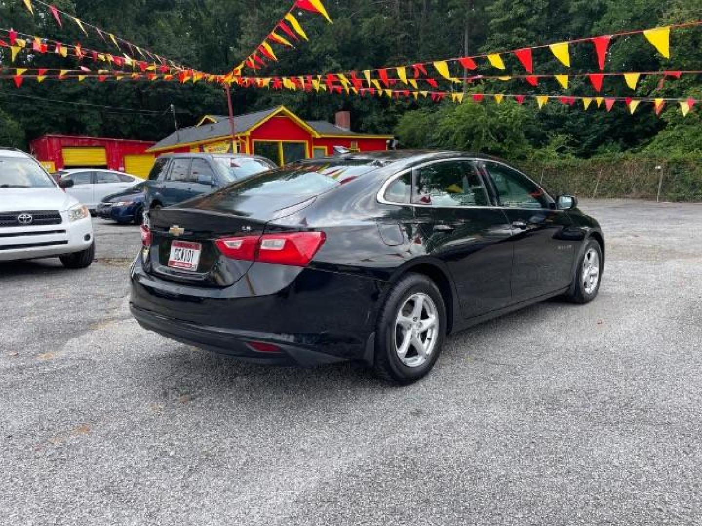 2016 Black Chevrolet Malibu LS (1G1ZB5ST9GF) with an 1.5L L4 DOHC 16V engine, 6-Speed Automatic transmission, located at 1806 Veterans Memorial Hwy SW, Austell, GA, 30168, (770) 944-9558, 33.817959, -84.606987 - Photo#2