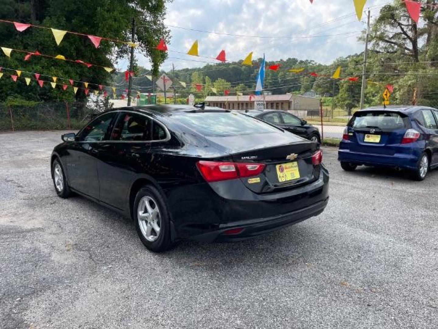 2016 Black Chevrolet Malibu LS (1G1ZB5ST9GF) with an 1.5L L4 DOHC 16V engine, 6-Speed Automatic transmission, located at 1806 Veterans Memorial Hwy SW, Austell, GA, 30168, (770) 944-9558, 33.817959, -84.606987 - Photo#4