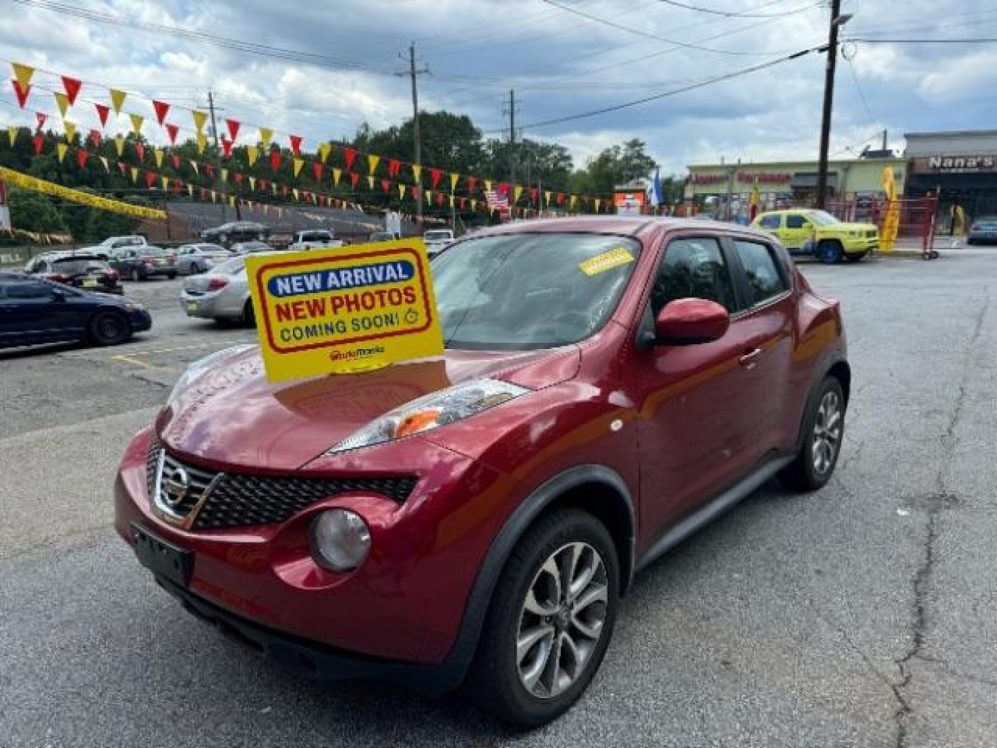 2013 Red Nissan Juke S AWD (JN8AF5MV3DT) with an 1.6L L4 DOHC 16V engine, Continuously Variable Transmission transmission, located at 1806 Veterans Memorial Hwy SW, Austell, GA, 30168, (770) 944-9558, 33.817959, -84.606987 - Photo#0