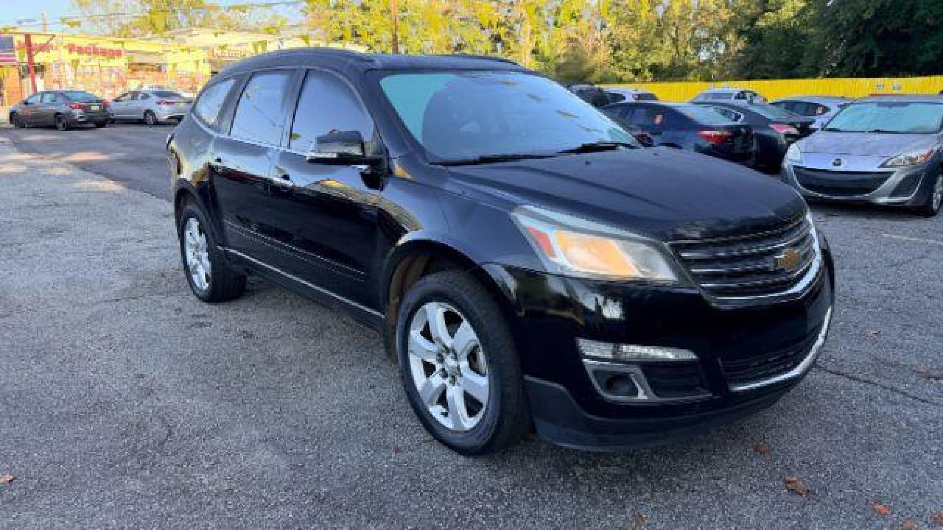 2016 Black Chevrolet Traverse 1LT FWD (1GNKRGKD0GJ) with an 3.6L V6 DOHC 24V engine, 6-Speed Automatic transmission, located at 1806 Veterans Memorial Hwy SW, Austell, GA, 30168, (770) 944-9558, 33.817959, -84.606987 - Photo#2