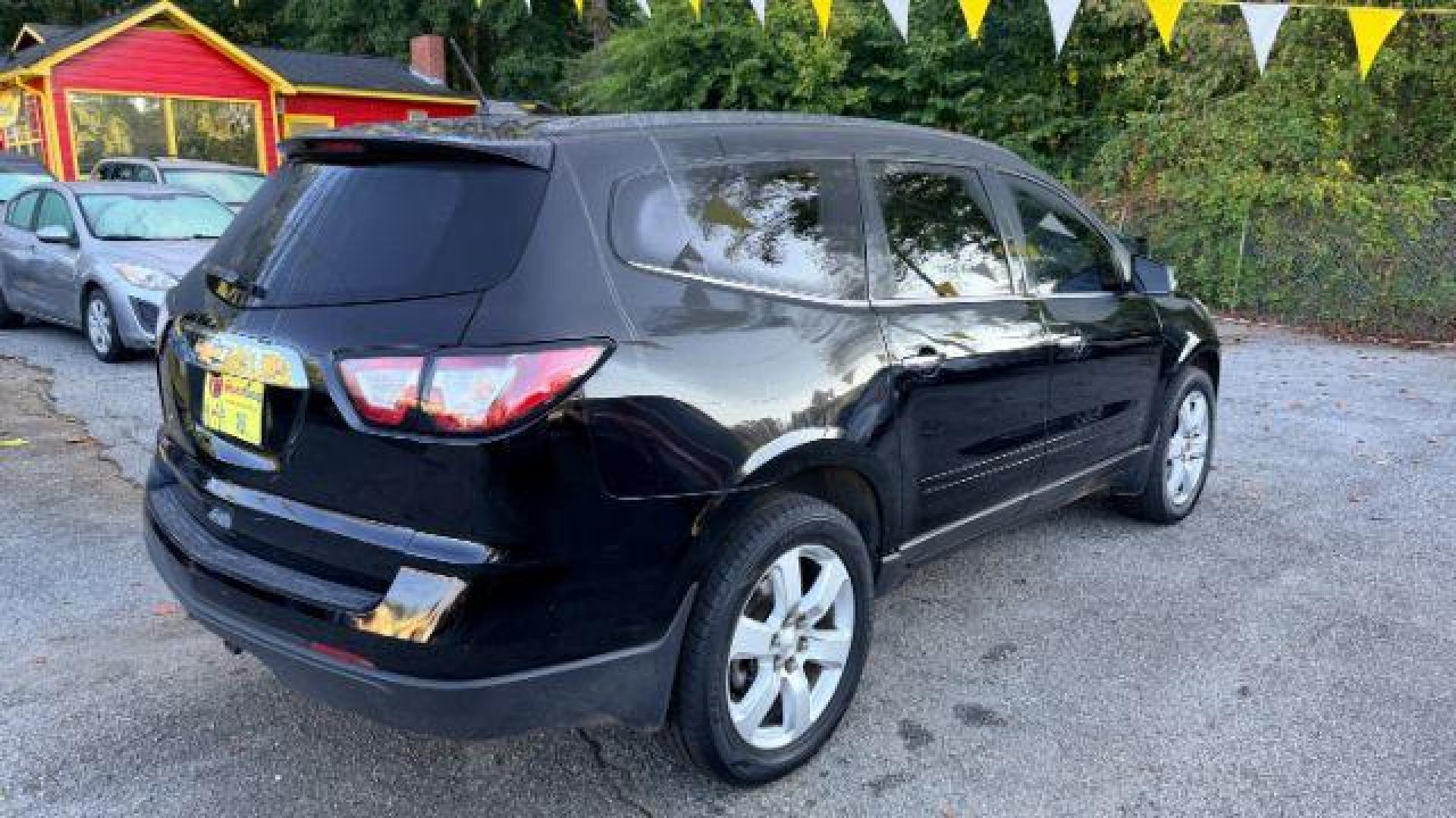 2016 Black Chevrolet Traverse 1LT FWD (1GNKRGKD0GJ) with an 3.6L V6 DOHC 24V engine, 6-Speed Automatic transmission, located at 1806 Veterans Memorial Hwy SW, Austell, GA, 30168, (770) 944-9558, 33.817959, -84.606987 - Photo#3