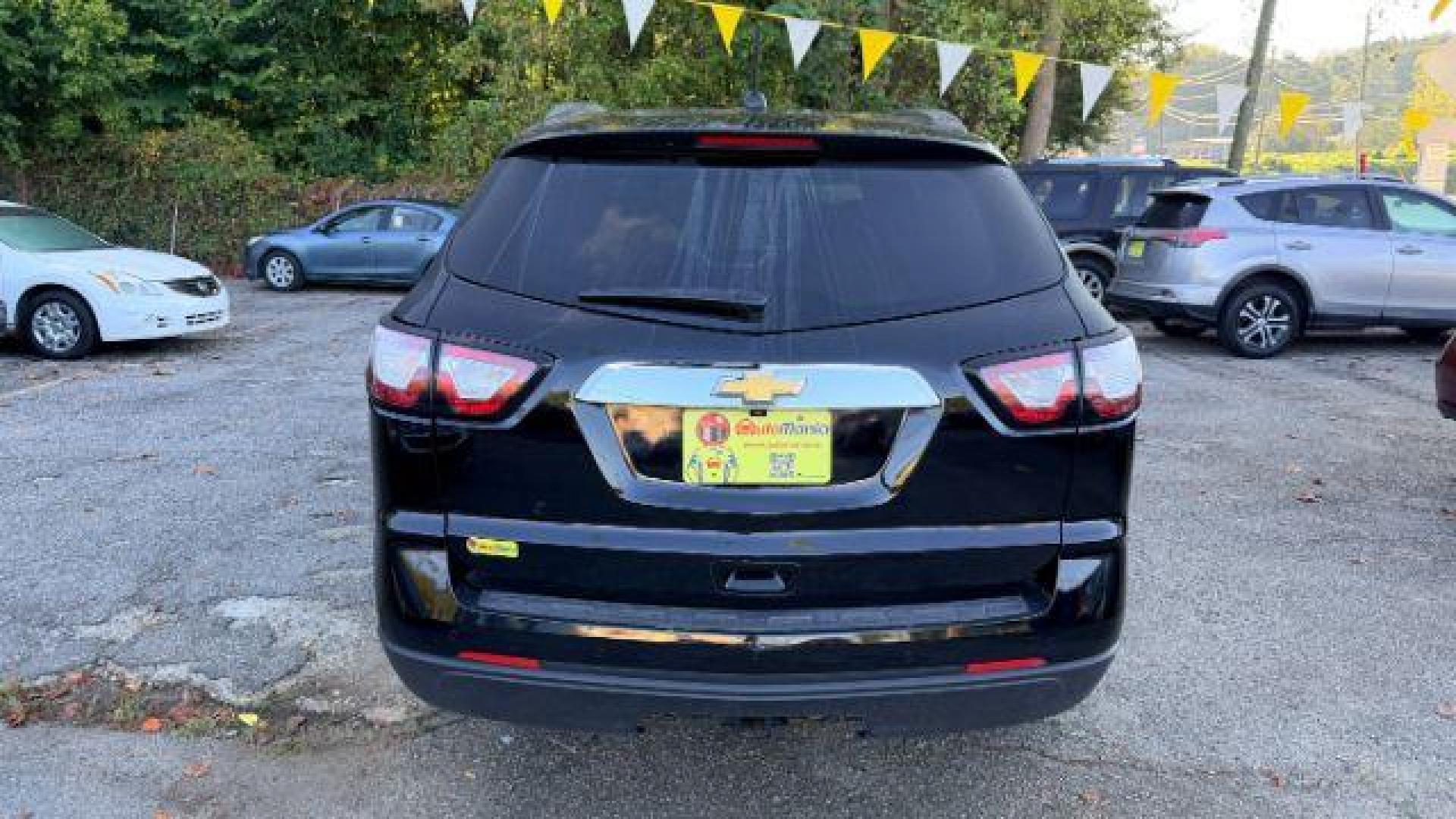 2016 Black Chevrolet Traverse 1LT FWD (1GNKRGKD0GJ) with an 3.6L V6 DOHC 24V engine, 6-Speed Automatic transmission, located at 1806 Veterans Memorial Hwy SW, Austell, GA, 30168, (770) 944-9558, 33.817959, -84.606987 - Photo#4