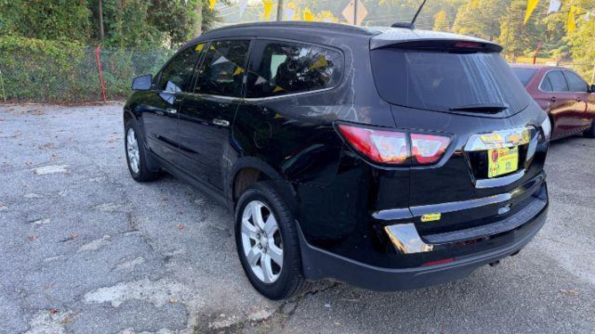 2016 Black Chevrolet Traverse 1LT FWD (1GNKRGKD0GJ) with an 3.6L V6 DOHC 24V engine, 6-Speed Automatic transmission, located at 1806 Veterans Memorial Hwy SW, Austell, GA, 30168, (770) 944-9558, 33.817959, -84.606987 - Photo#5