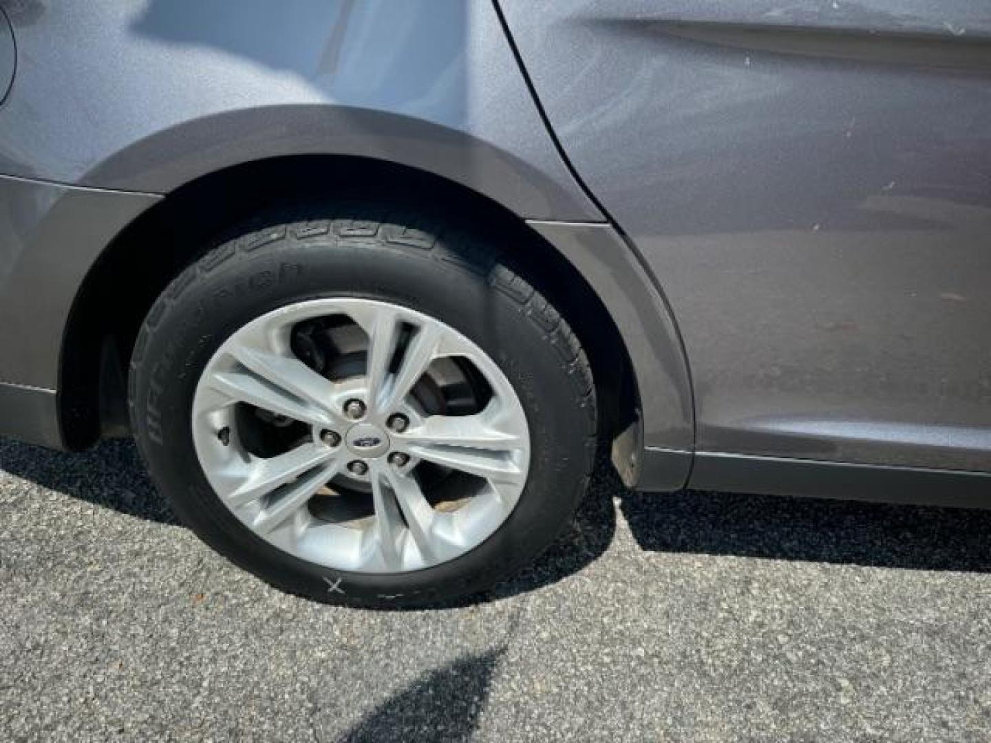 2013 Gray Ford Taurus SEL FWD (1FAHP2E8XDG) with an 3.5L V6 DOHC 24V engine, 6-Speed Automatic transmission, located at 1806 Veterans Memorial Hwy SW, Austell, GA, 30168, (770) 944-9558, 33.817959, -84.606987 - Photo#19