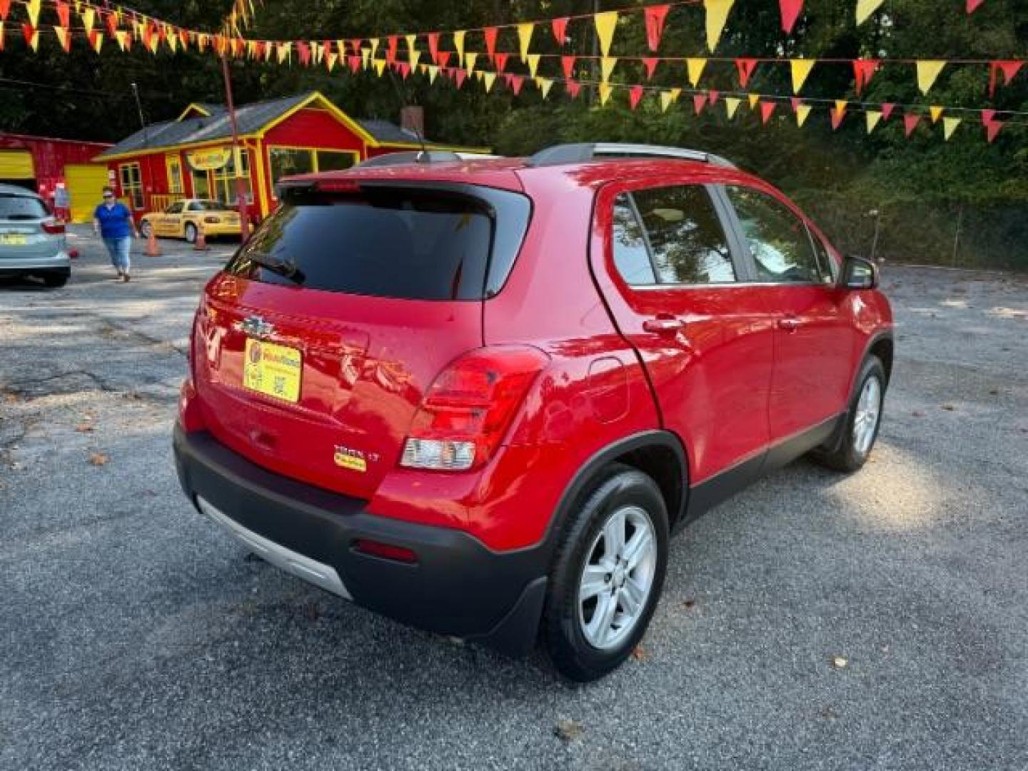 2015 Red Chevrolet Trax LT FWD (KL7CJLSBXFB) with an 1.4L L4 DOHC 16V engine, 6-Speed Automatic transmission, located at 1806 Veterans Memorial Hwy SW, Austell, GA, 30168, (770) 944-9558, 33.817959, -84.606987 - Photo#2