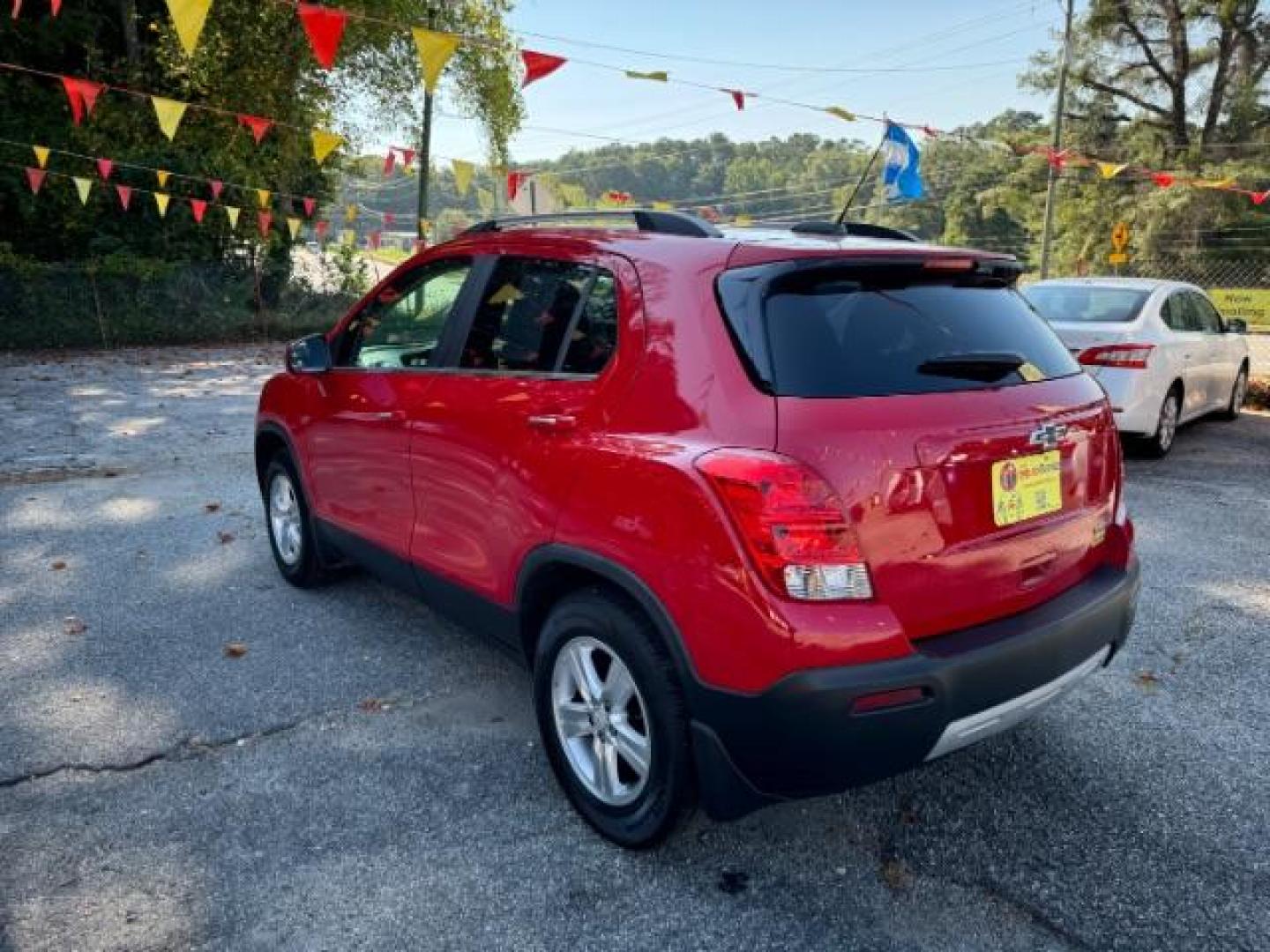 2015 Red Chevrolet Trax LT FWD (KL7CJLSBXFB) with an 1.4L L4 DOHC 16V engine, 6-Speed Automatic transmission, located at 1806 Veterans Memorial Hwy SW, Austell, GA, 30168, (770) 944-9558, 33.817959, -84.606987 - Photo#4