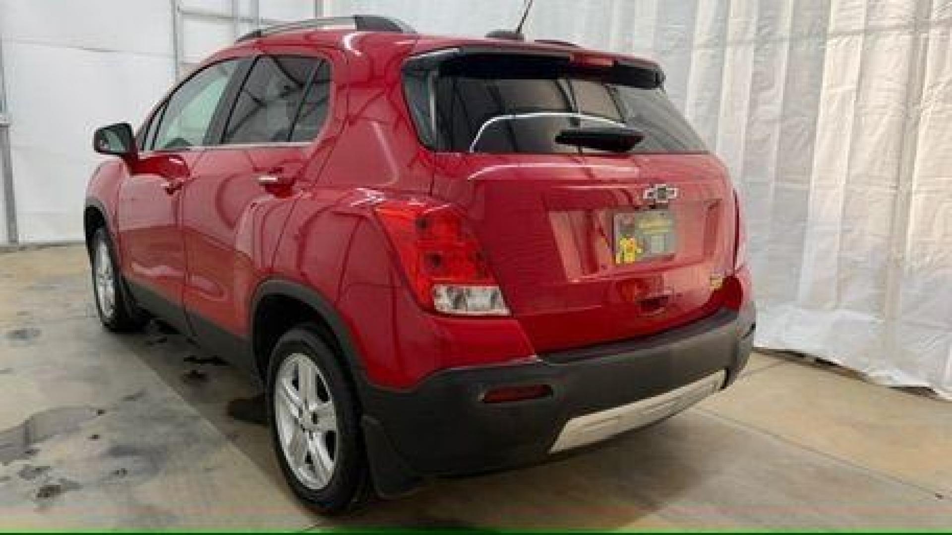 2015 Red Chevrolet Trax LT FWD (KL7CJLSBXFB) with an 1.4L L4 DOHC 16V engine, 6-Speed Automatic transmission, located at 1806 Veterans Memorial Hwy SW, Austell, GA, 30168, (770) 944-9558, 33.817959, -84.606987 - Photo#3