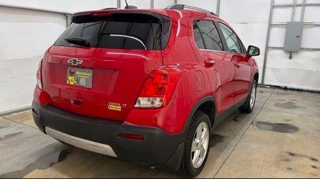 2015 Red Chevrolet Trax LT FWD (KL7CJLSBXFB) with an 1.4L L4 DOHC 16V engine, 6-Speed Automatic transmission, located at 1806 Veterans Memorial Hwy SW, Austell, GA, 30168, (770) 944-9558, 33.817959, -84.606987 - Photo#5