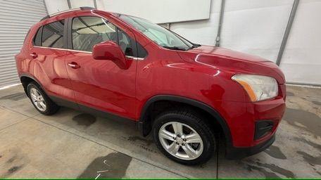 2015 Red Chevrolet Trax LT FWD (KL7CJLSBXFB) with an 1.4L L4 DOHC 16V engine, 6-Speed Automatic transmission, located at 1806 Veterans Memorial Hwy SW, Austell, GA, 30168, (770) 944-9558, 33.817959, -84.606987 - Photo#7