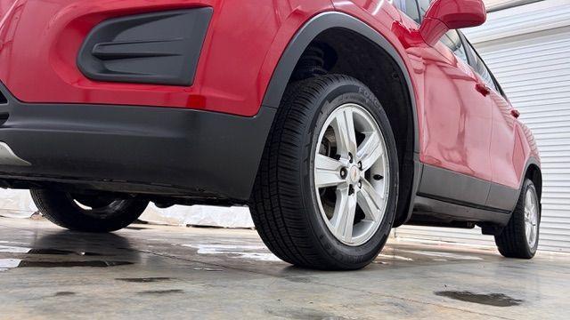 2015 Red Chevrolet Trax LT FWD (KL7CJLSBXFB) with an 1.4L L4 DOHC 16V engine, 6-Speed Automatic transmission, located at 1806 Veterans Memorial Hwy SW, Austell, GA, 30168, (770) 944-9558, 33.817959, -84.606987 - Photo#20