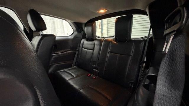 2014 Red Nissan Pathfinder SV 2WD (5N1AR2MN0EC) with an 3.5L V6 DOHC 24V engine, Continuously Variable Transmission transmission, located at 1806 Veterans Memorial Hwy SW, Austell, GA, 30168, (770) 944-9558, 33.817959, -84.606987 - This 2014 Nissan Pathfinder has passed a 100+ point inspection performed in our own service center. It's awesome looking with no issues, no odors, and a very clean interior. It features leather seats and a rear entertainment system (TV), and the tires are in great condition. Please note: this vehicl- Photo#16