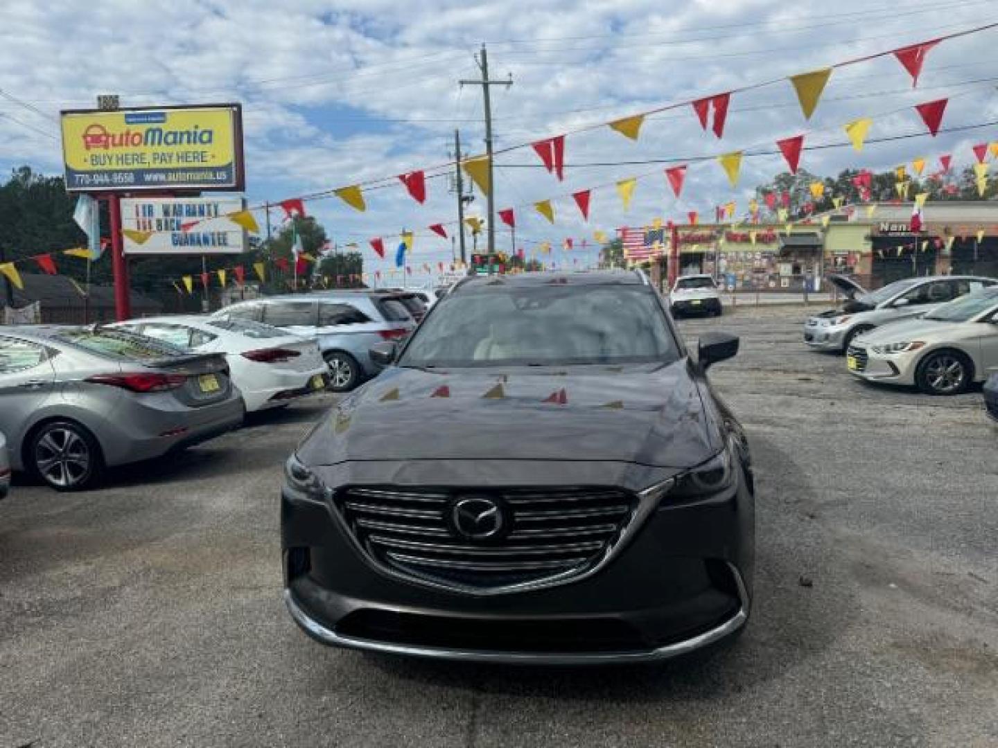 2017 Brown Mazda CX-9 Grand Touring AWD (JM3TCBDY3H0) with an 2.5L L4 DOHC 16V engine, 6-Speed Automatic transmission, located at 1806 Veterans Memorial Hwy SW, Austell, GA, 30168, (770) 944-9558, 33.817959, -84.606987 - Photo#0