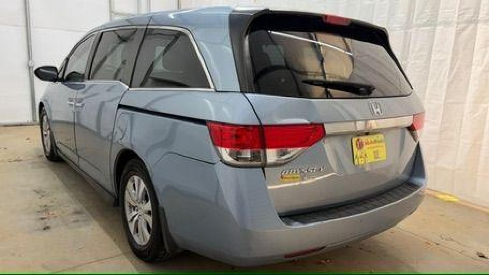 2014 Blue Honda Odyssey EX-L (5FNRL5H61EB) with an 3.5L V6 SOHC 24V engine, 6-Speed Automatic transmission, located at 1806 Veterans Memorial Hwy SW, Austell, GA, 30168, (770) 944-9558, 33.817959, -84.606987 - Photo#3