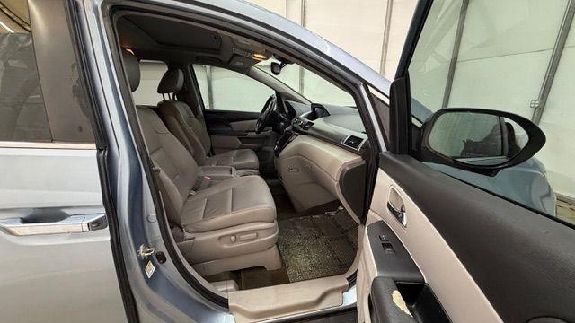 2014 Blue Honda Odyssey EX-L (5FNRL5H61EB) with an 3.5L V6 SOHC 24V engine, 6-Speed Automatic transmission, located at 1806 Veterans Memorial Hwy SW, Austell, GA, 30168, (770) 944-9558, 33.817959, -84.606987 - Photo#18