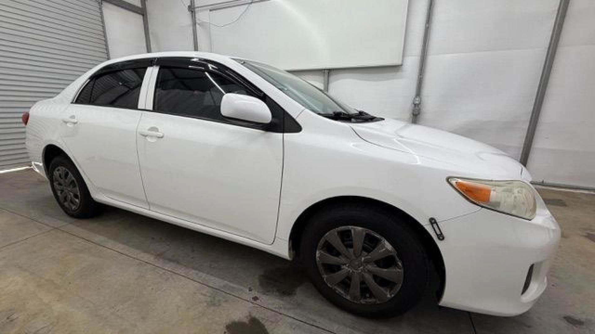 2013 White Toyota Corolla LE 4-Speed AT (JTDBU4EE4DJ) with an 1.8L L4 DOHC 16V engine, 4-Speed Automatic transmission, located at 1806 Veterans Memorial Hwy SW, Austell, GA, 30168, (770) 944-9558, 33.817959, -84.606987- Photo#7