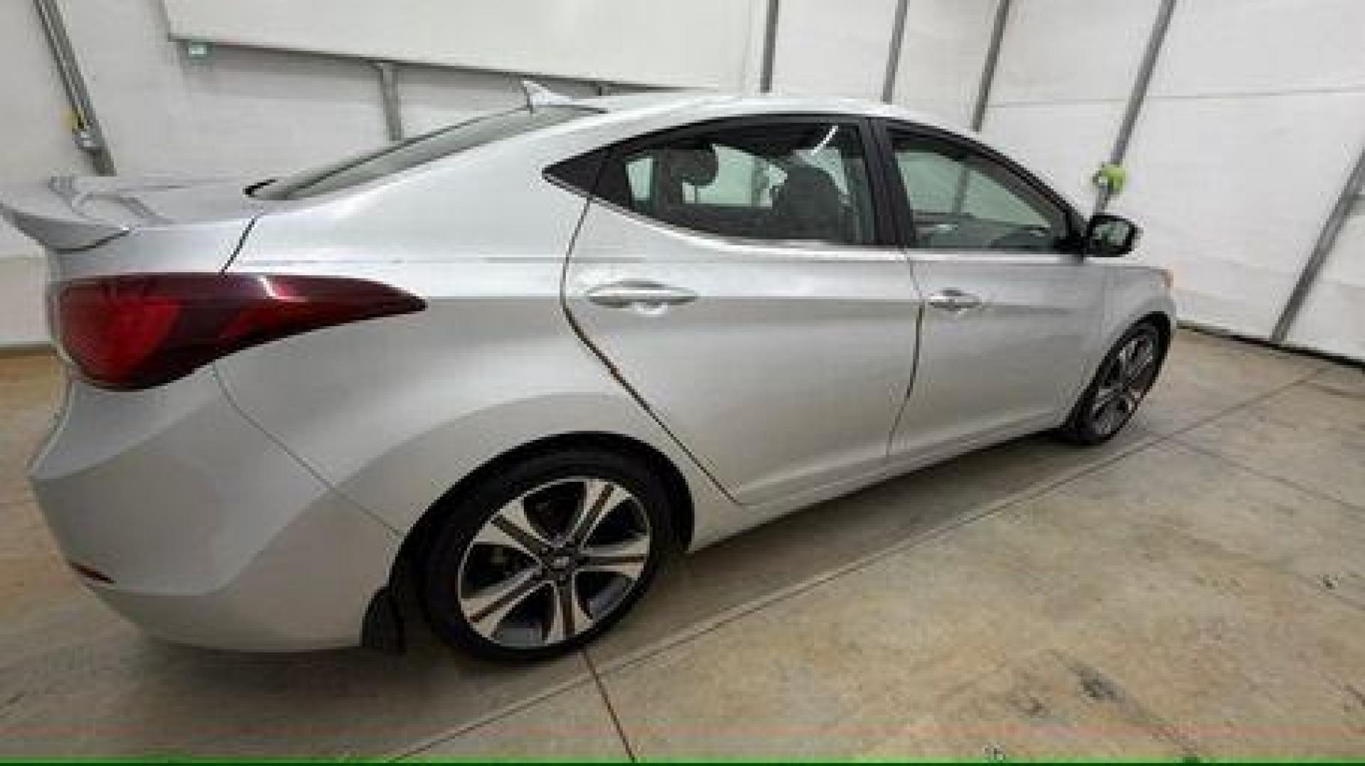 2014 Silver Hyundai Elantra GLS A/T (KMHDH4AHXEU) with an 2.0L L4 DOHC 16V engine, 6-Speed Automatic transmission, located at 1806 Veterans Memorial Hwy SW, Austell, GA, 30168, (770) 944-9558, 33.817959, -84.606987 - Photo#6
