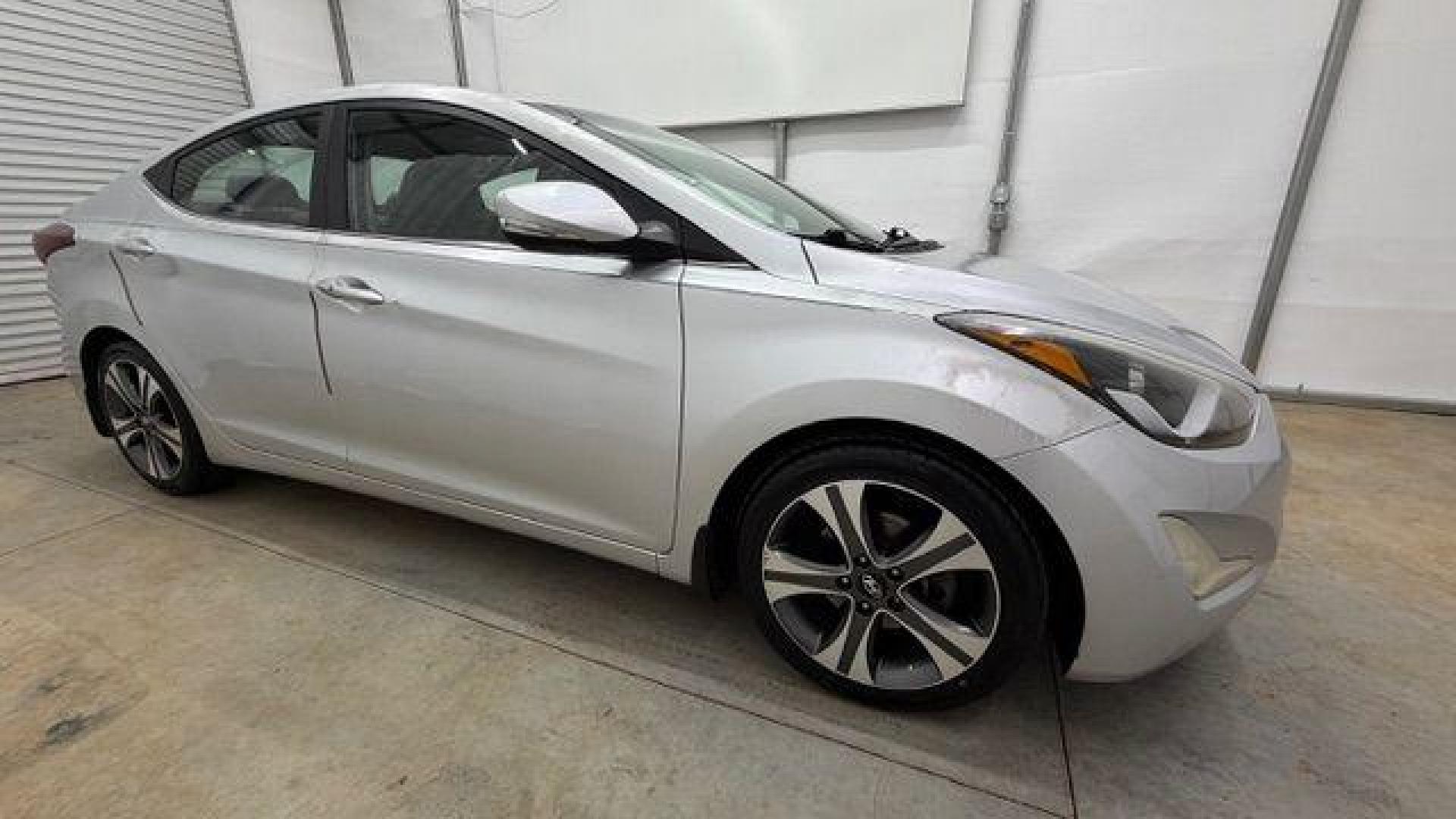 2014 Silver Hyundai Elantra GLS A/T (KMHDH4AHXEU) with an 2.0L L4 DOHC 16V engine, 6-Speed Automatic transmission, located at 1806 Veterans Memorial Hwy SW, Austell, GA, 30168, (770) 944-9558, 33.817959, -84.606987 - Photo#7