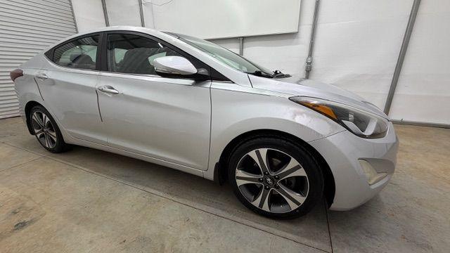 2014 Silver Hyundai Elantra GLS A/T (KMHDH4AHXEU) with an 2.0L L4 DOHC 16V engine, 6-Speed Automatic transmission, located at 1806 Veterans Memorial Hwy SW, Austell, GA, 30168, (770) 944-9558, 33.817959, -84.606987 - Photo#7