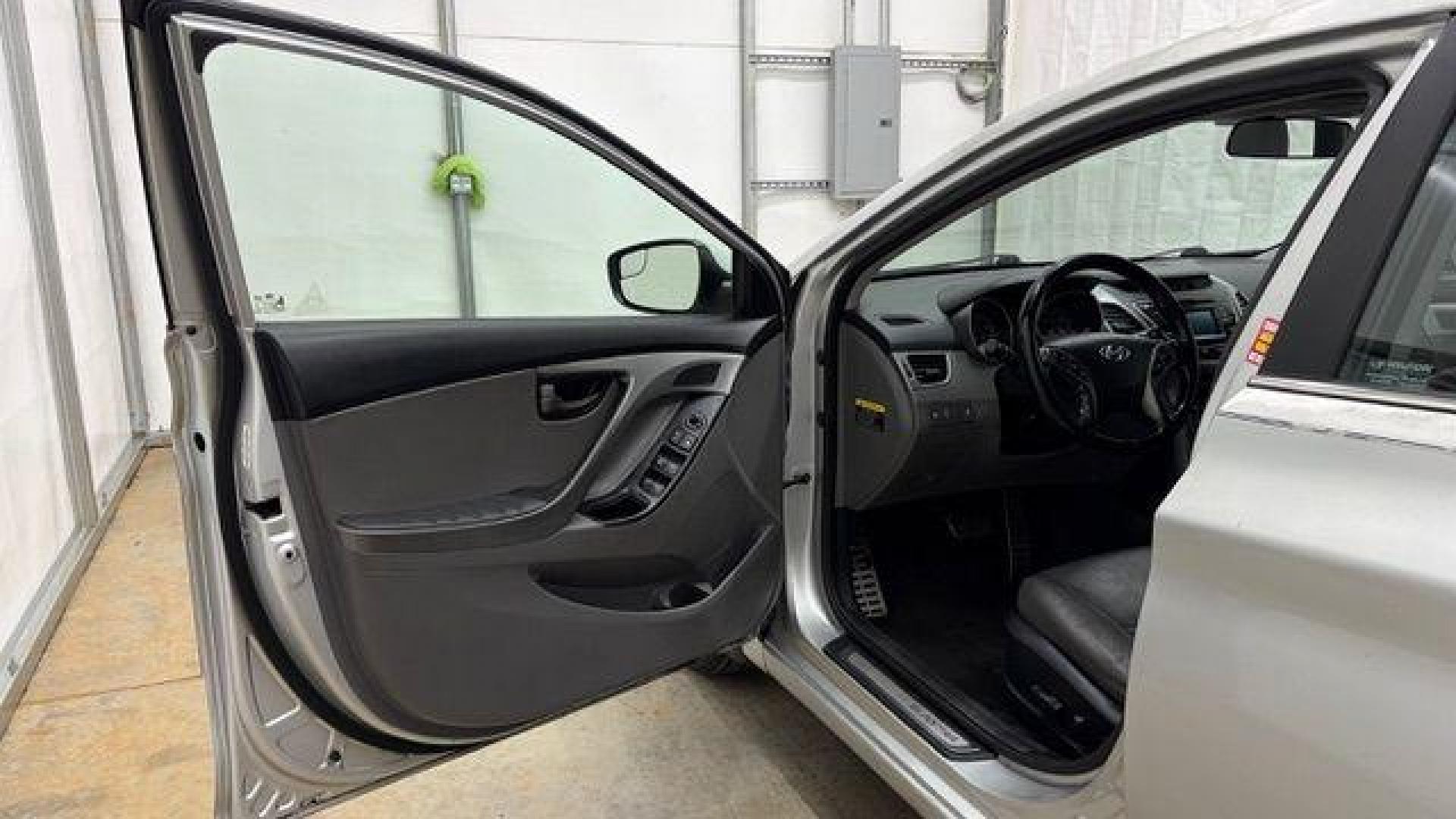 2014 Silver Hyundai Elantra GLS A/T (KMHDH4AHXEU) with an 2.0L L4 DOHC 16V engine, 6-Speed Automatic transmission, located at 1806 Veterans Memorial Hwy SW, Austell, GA, 30168, (770) 944-9558, 33.817959, -84.606987 - Photo#10