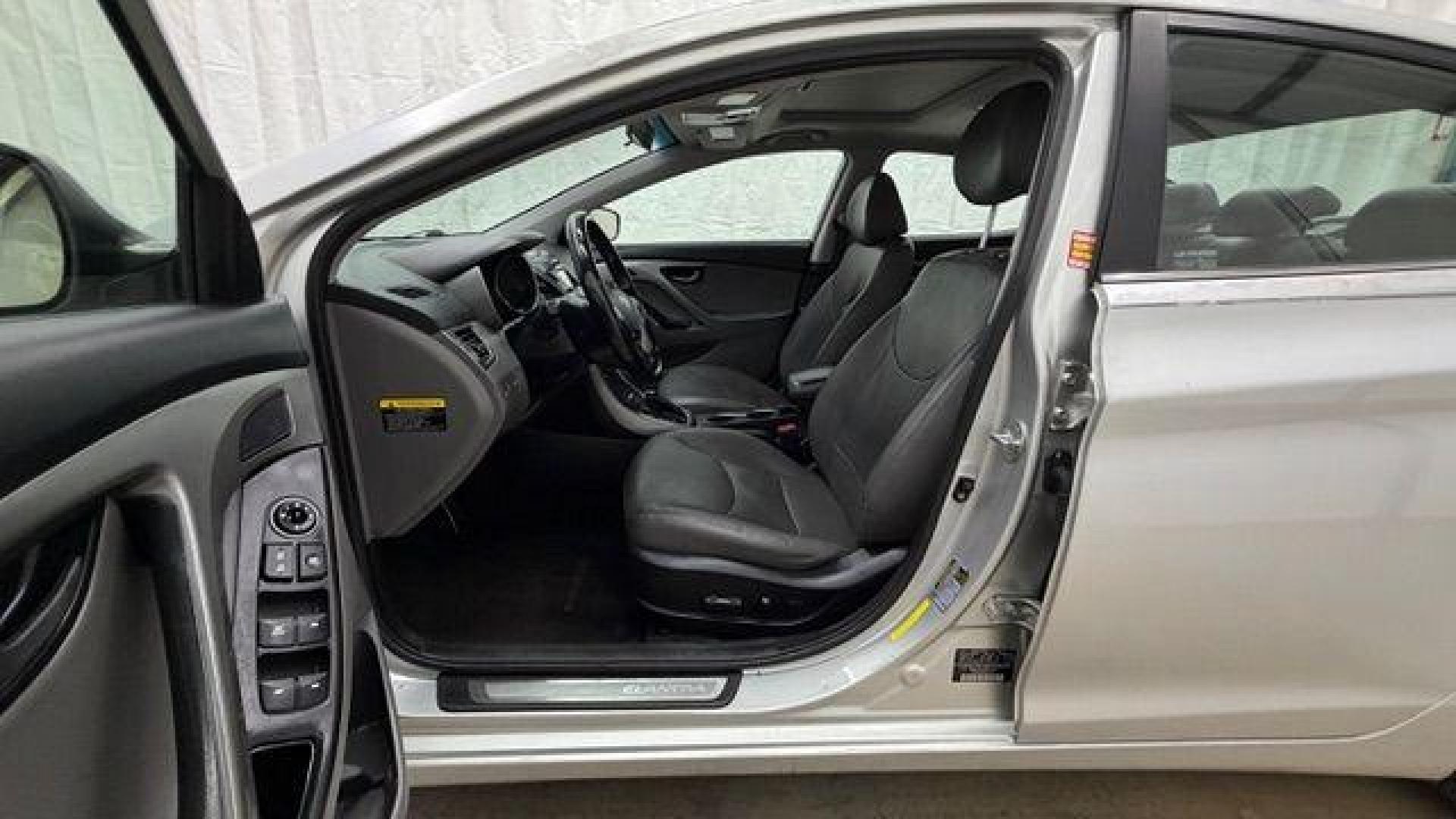 2014 Silver Hyundai Elantra GLS A/T (KMHDH4AHXEU) with an 2.0L L4 DOHC 16V engine, 6-Speed Automatic transmission, located at 1806 Veterans Memorial Hwy SW, Austell, GA, 30168, (770) 944-9558, 33.817959, -84.606987 - Photo#12