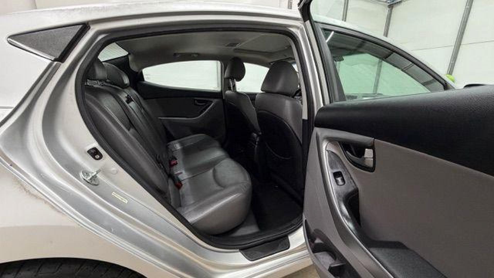 2014 Silver Hyundai Elantra GLS A/T (KMHDH4AHXEU) with an 2.0L L4 DOHC 16V engine, 6-Speed Automatic transmission, located at 1806 Veterans Memorial Hwy SW, Austell, GA, 30168, (770) 944-9558, 33.817959, -84.606987 - Photo#16