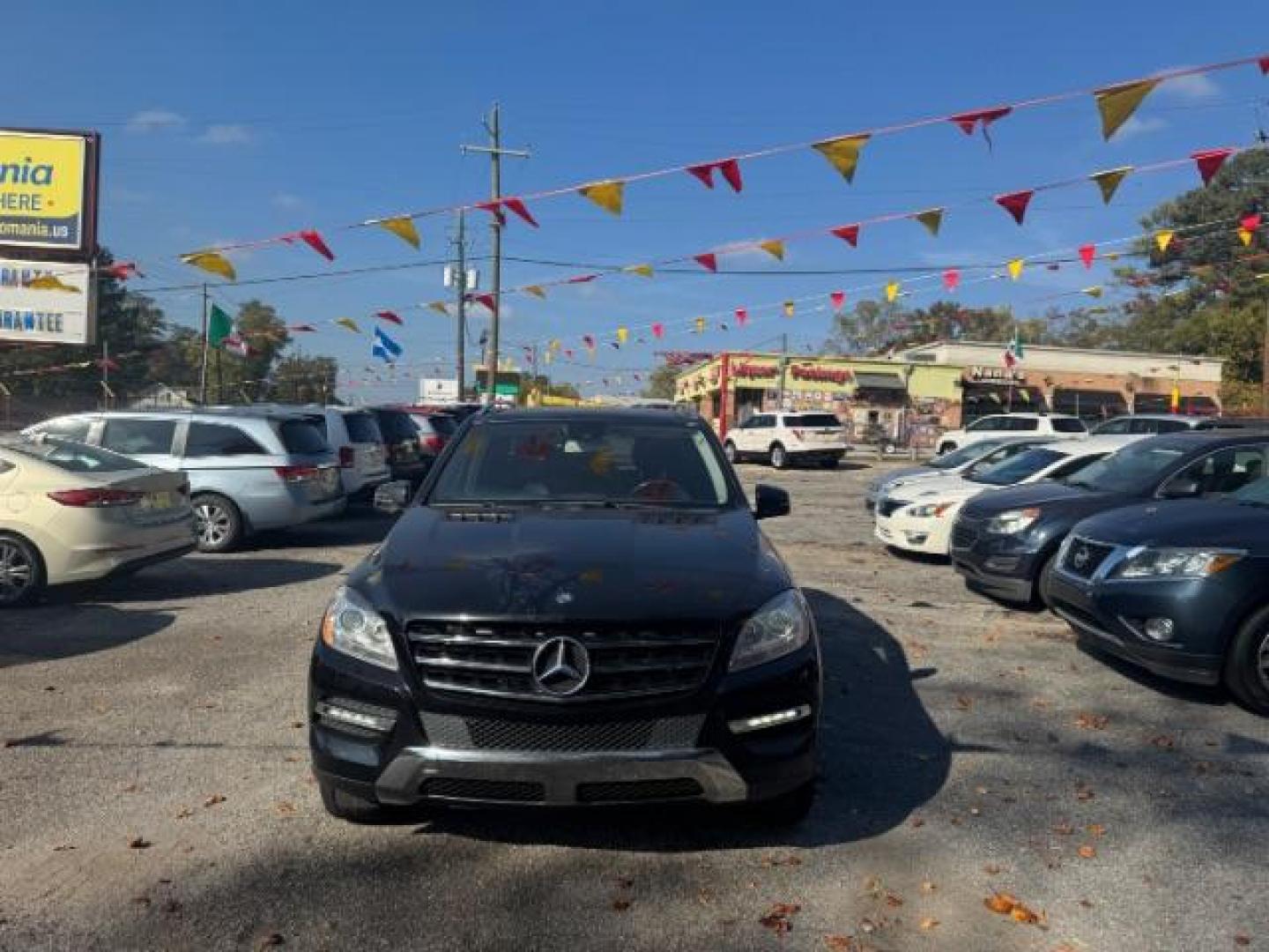 2014 Black Mercedes-Benz M-Class ML350 (4JGDA5JB5EA) with an 3.5L V6 DOHC 24V engine, 7-Speed Automatic transmission, located at 1806 Veterans Memorial Hwy SW, Austell, GA, 30168, (770) 944-9558, 33.817959, -84.606987 - Photo#1