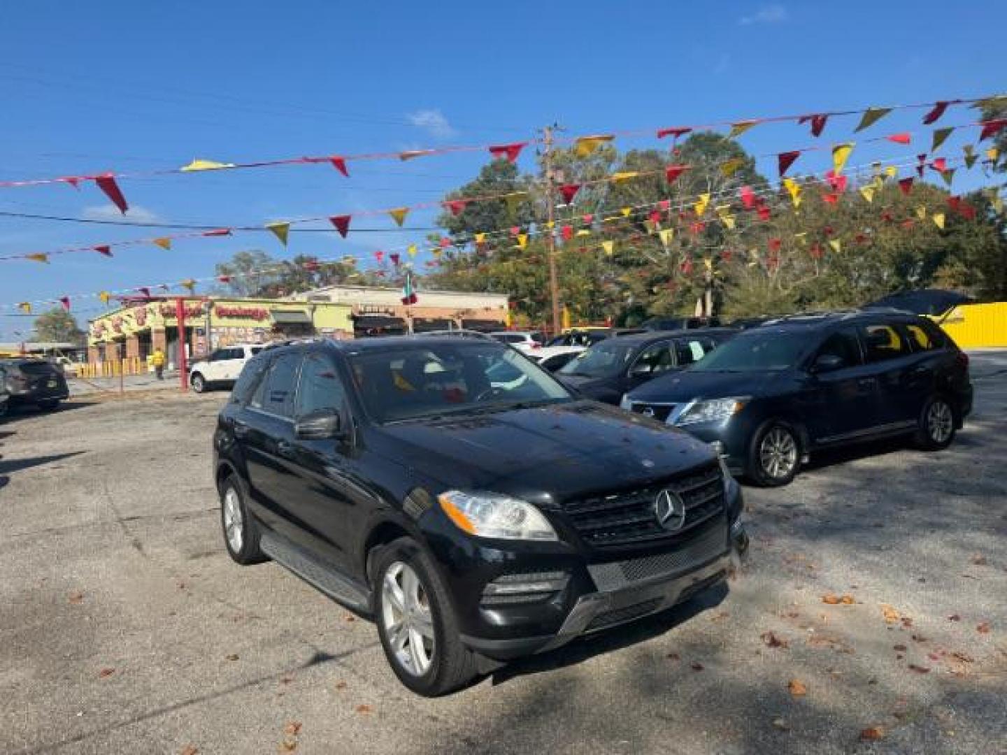 2014 Black Mercedes-Benz M-Class ML350 (4JGDA5JB5EA) with an 3.5L V6 DOHC 24V engine, 7-Speed Automatic transmission, located at 1806 Veterans Memorial Hwy SW, Austell, GA, 30168, (770) 944-9558, 33.817959, -84.606987 - Photo#2